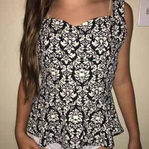 Black and white hip accentuating top